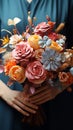 Floral artistry Careful hands fashion a lovely bouquet from a colorful assortment