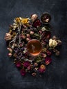 Herbal tea, dried herbs and flowers and vintage scissors, top view Royalty Free Stock Photo