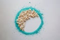 Floral beige half moon inside turquoise colored powder circle Royalty Free Stock Photo