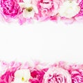 Floral border frame made of pink roses on white background. Flat lay, Top view. Valentines day composition Royalty Free Stock Photo