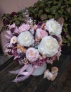 Floral bouquet in hat box. Beautiful delicate pink and white flowers in hat gift box grey color.