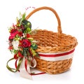 Floral Composition With Flowers, Greenery And Ribbons Hanging On The Handle Of A Wicker Basket On White Background