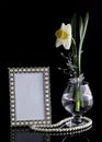 Floral composition with a frame and glass Royalty Free Stock Photo