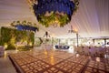 Floral decoration hanging from ceiling at wedding venue