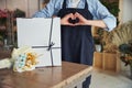 Floral designer making a love sign with hands