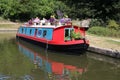 Floral display on colorful narrow boat Kennet Avon