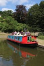 Floral display on colorful narrow boat Kennet