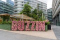 A floral display in Manchester, UK, at The Lawn Club outdoor bar in Spinningfields spells, BUZZIN' Royalty Free Stock Photo