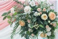 Floral Elegance: Wedding Arch Section Adorned with Roses, Greenery, and Cloth. A Beautiful Arrangement Creating a Charming