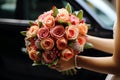Floral embrace The bride holds a vibrant bouquet of roses