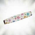 A floral-engraved nail stamping tool, floating in mid air horizontally on a solid white background Royalty Free Stock Photo