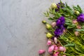 Floral flatlay. Pink ranunculus and purple lisianthus