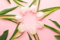 Floral frame background with tulips flowers on pink pastel background. Flat lay, top view. Spring time background Royalty Free Stock Photo