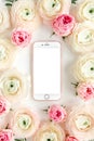 Floral frame borders made of pink ranunculus and roses flower buds on white background. Flat lay, top view floral Royalty Free Stock Photo