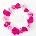 Floral frame made of pink roses flowers on white background. Flat lay, Top view. Valentines day Royalty Free Stock Photo