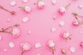 Floral frame made of roses flowers and petals on pink background. Flat lay, Top view. Valentines day background Royalty Free Stock Photo