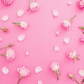 Floral frame made of roses and petals on pink background. Flat lay, Top view. Valentines day background Royalty Free Stock Photo