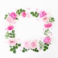 Floral frame of pastel pink roses, peonies and green leaves on white background. Flat lay, top view. Spring time composition Royalty Free Stock Photo