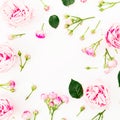 Floral frame pattern with roses flowers and buds on white background. Flat lay, top view. Pastel flowers Royalty Free Stock Photo