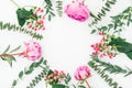 Floral frame with pink peonies and eucalyptus branches on white background. Flat lay