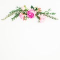 Floral frame with pink peonies and roses flowers and eucalyptus on white background. Flat lay, top view Royalty Free Stock Photo