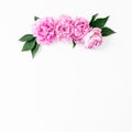 Floral frame with pink rose flowers and leaves white background. Flat lay, Top view. Flowers texture. Royalty Free Stock Photo