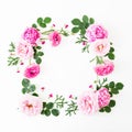 Floral frame of pink roses, peonies and leaves on white background. Flat lay, top view. Summer time flowers Royalty Free Stock Photo