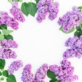 Floral frame of purple lilac flowers branches on white background. Flat lay, top view Royalty Free Stock Photo
