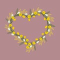 Floral frame in the shape of a heart. Spring flowers on a pink background