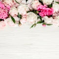 Floral frame wreath made of pink and beige peonies flower buds, eucalyptus branches and leaves isolated on white wooden Royalty Free Stock Photo
