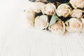 Floral greeting card mockup. White roses on wooden background, s Royalty Free Stock Photo