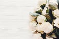 Floral greeting card mockup. White roses on wooden background, s Royalty Free Stock Photo