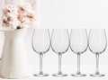 Floral Mockup - 4 empty wine glasses Royalty Free Stock Photo