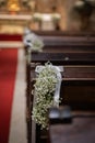 Floral ornamentation inside a worship space, church. Festive decoration for wedding event Royalty Free Stock Photo
