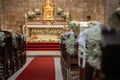 Floral ornamentation inside a worship space, church. Festive decoration for wedding event Royalty Free Stock Photo