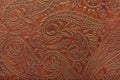 Floral pattern in brown leather