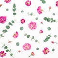 Floral pattern of dried pink flowers and eucalyptus branches on white background. Flat lay, top view. Valentines day background Royalty Free Stock Photo