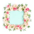 Floral pattern frame made of pink ranunculus and roses flower buds on white background. Flat lay, top view floral Royalty Free Stock Photo