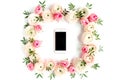 Floral pattern frame made of pink ranunculus and roses flower buds on white background. Flat lay, top view floral Royalty Free Stock Photo