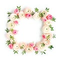 Floral pattern frame made of pink ranunculus and roses flower buds on white background. Flat lay, top view floral Royalty Free Stock Photo