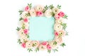 Floral pattern frame made of pink ranunculus and roses flower buds on white background. Flat lay, top view floral Royalty Free Stock Photo