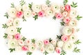 Floral pattern frame made of pink ranunculus and roses flower buds on white background. Flat lay, top view floral Royalty Free Stock Photo