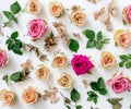Floral pattern made of pink and beige roses, green leaves, branches on white background. Flat lay, top view. Valentine\'s Royalty Free Stock Photo