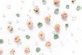 Floral pattern made of pink roses, green leaves, branches on white background. Flat lay, top view. Valentine`s Royalty Free Stock Photo