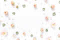 Floral pattern made of pink roses, green leaves, branches on white background. Flat lay, top view. Valentine`s Royalty Free Stock Photo