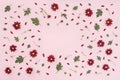 Floral pattern made of red chrysanthemum, green leaves on pink background. Flat lay, top view. Valentines background. Pattern of