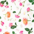 Floral pattern with pink roses flowers and roses petals on white background. Valentines day. Flat lay, top view Royalty Free Stock Photo