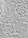 Floral patterned glass. Monochrome photo.
