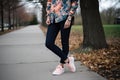 floral print shirt, paired with jeans and sneakers