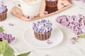 Floral purple cake in trending Dreamy Escapism. Leisure and relax coffee time. Spring purple background. Beautiful food